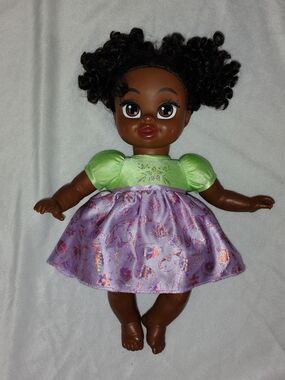 Disney Brown-Skinned Doll with Black Curly Hair, Purple Skirt & Bright Green Top